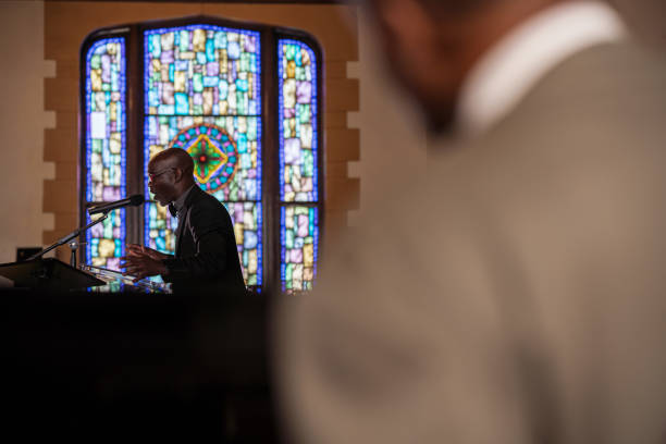 istock Black Congregation attend Black Baptist Church service 1443625289