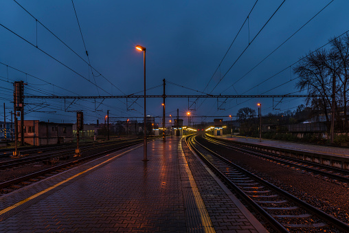 View on Prague Liben railway station in wet rainy evening