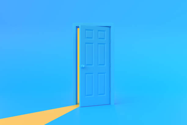 istock Yellow light going through the opening door in blue background room 1443625577