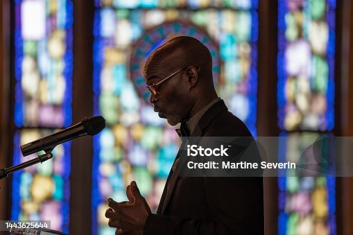 istock Black Congregation attend Black Baptist Church service 1443625644