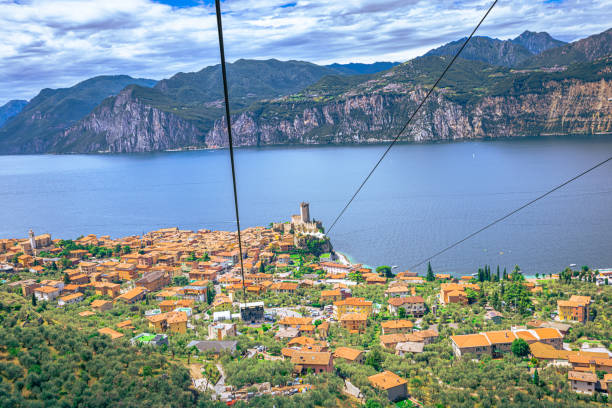 vista panoramica del lago di garda visto dal monte baldo, italia - larch tree stone landscape sky foto e immagini stock