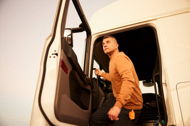 istock Truck driver leaving semi-truck cab 1443627274