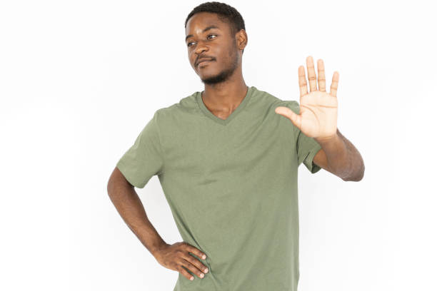 istock Dissatisfied young man showing stop sign 1443627602
