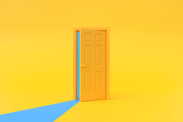 istock Blue light going through the opening door in yellow background room 1443628115