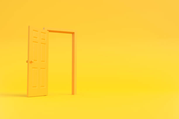 istock Open yellow door in a room with a yellow background 1443629895