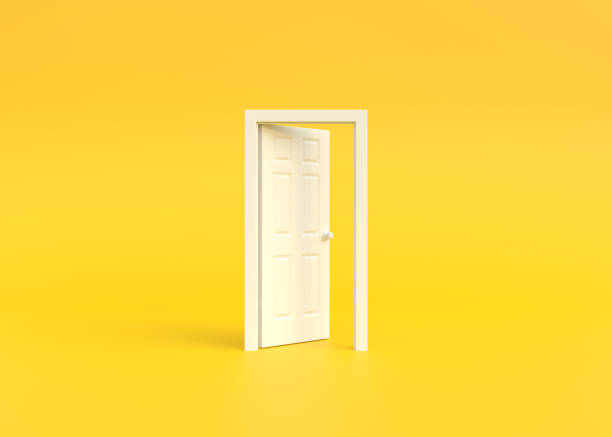 istock Open white door in a room with a yellow background 1443629922