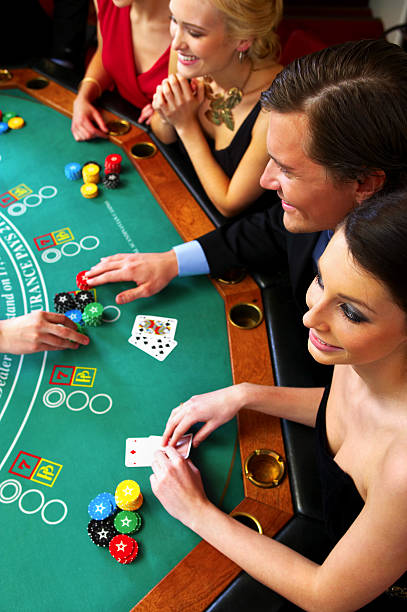 istock High angle view of people playing poker 144363020