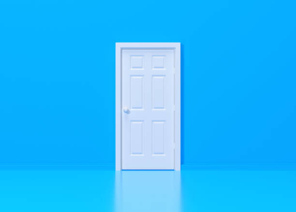 istock Closed white door in blue background room 1443630604