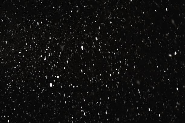 istock Falling snow on black background. Snowflake. Winter weather. Climate. Storm 1443632306