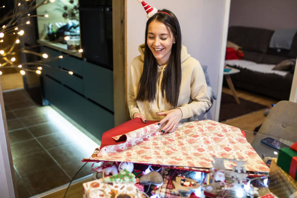 istock Happy wrapping Christmas presents 1443632862