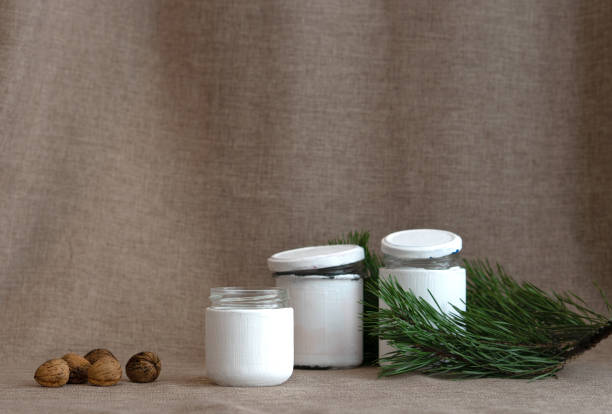 istock Advent Calendar for Christmas. Three white jars and nuts with. Step 4 1443633851