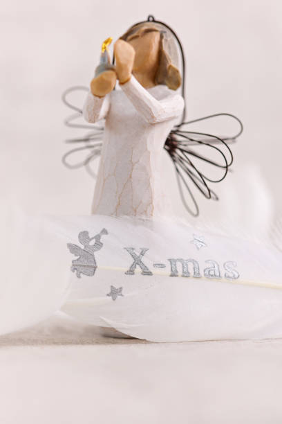 istock White angel and Gentle feather decoration. Christmas time background. 1443636002
