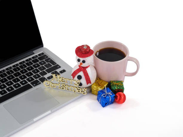 istock laptop, coffee and Christmas decorations 1443638556