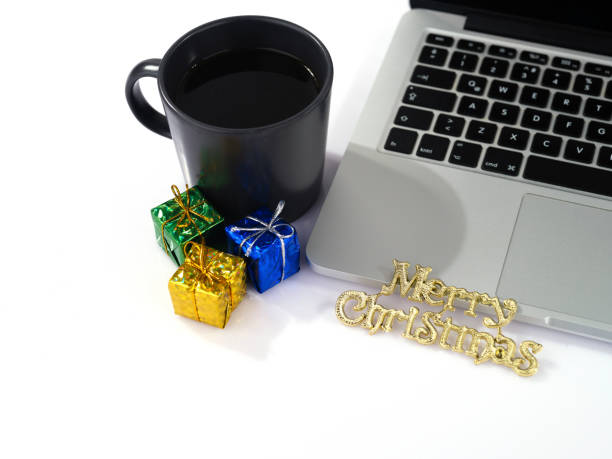 istock laptop, coffee and Christmas decorations 1443639273