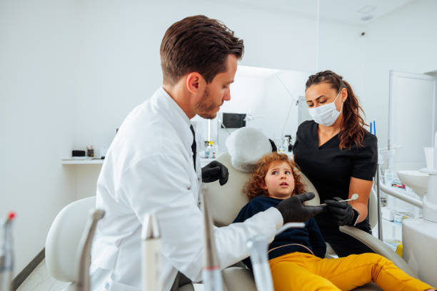 istock Scared child at dentist. 1443640092