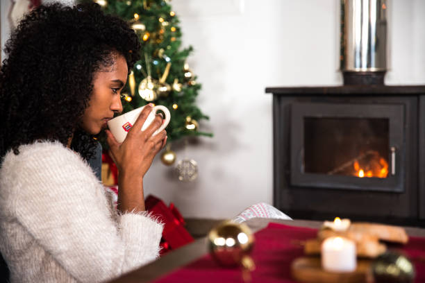 istock Black woman drinking hot beverage 1443640521