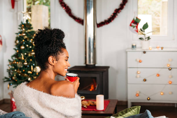 istock Woman with hot drink on Christmas 1443640556