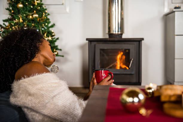 istock Black woman drinking hot beverage 1443640603