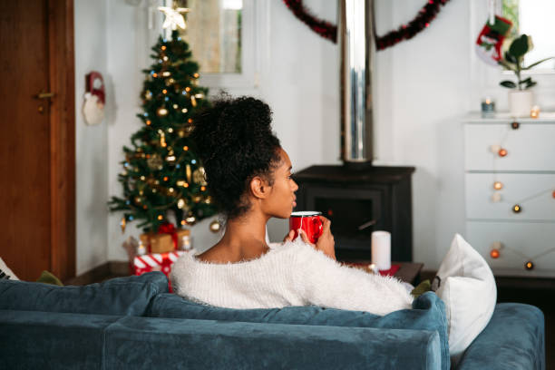 istock Woman with hot drink on Christmas 1443640762
