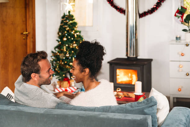 istock Diverse couple having fun in sofa in living room 1443640931