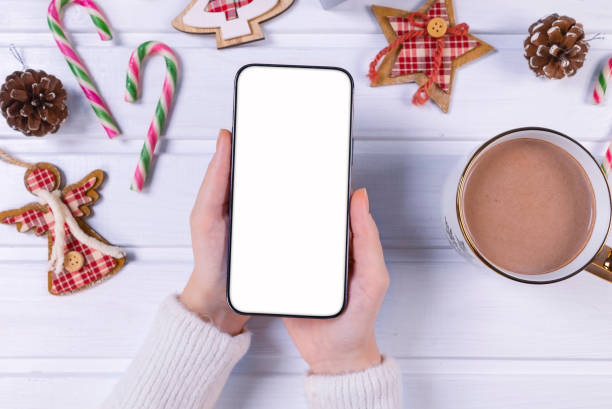 istock Close up smartphone with empty screen mockup on holiday background 1443641284