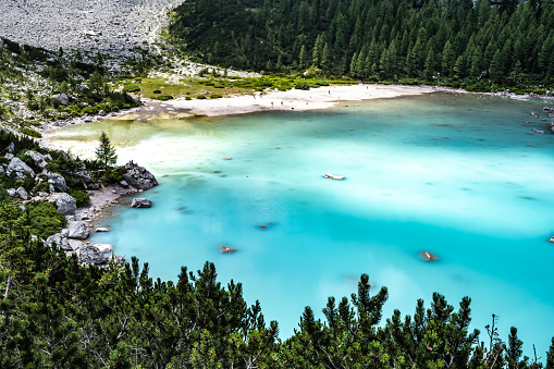 Description: Beautiful view on the turquoise Sorapis lake in the morning. Lake Sorapis, Dolomites, Belluno, Italy, Europe.