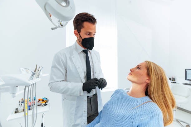 istock Female patient at dentist for checkup. 1443643007