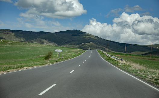 Asphalt road going through the hills