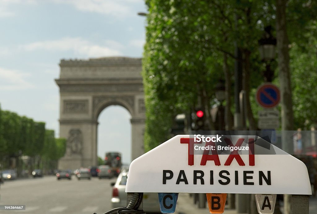 Parisian taxi Sign of a parisian taxi on the Champs-ElysAes. Arc de Triomphe - Paris Stock Photo