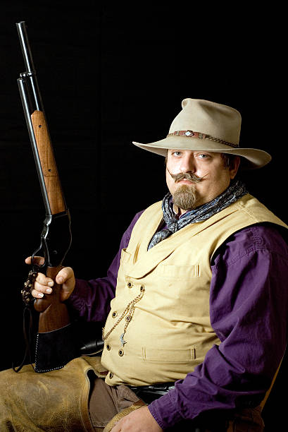istock Cowboy with his shotgun 144364714