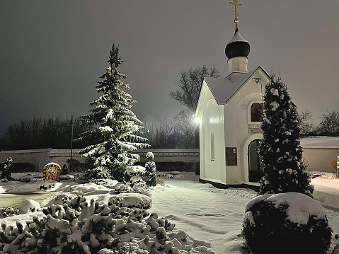 little church in bavarian alps during christmas time