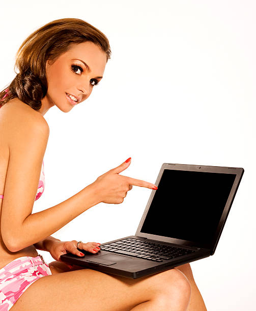 businesswoman on vacation beautiful woman wearing bikini with a laptop bikini atoll stock pictures, royalty-free photos & images