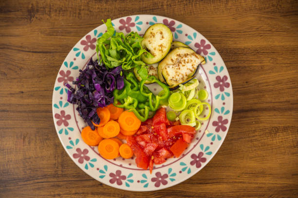 istock Porcelain plate with sliced vegetables. 1443651395