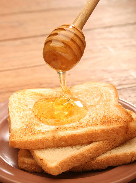 istock Honey pouring over toast bread 144365203
