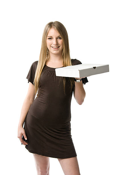 Woman holding pizza box stock photo