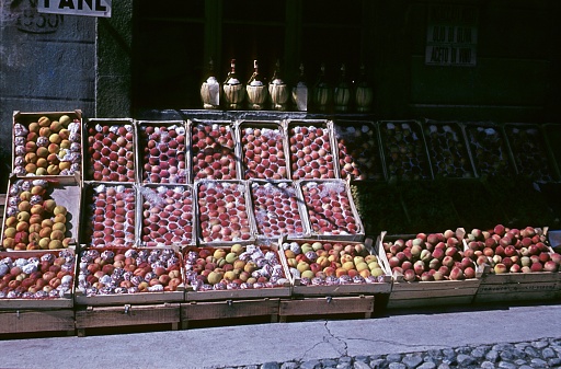 Bolzano, South Tyrol, Italy, 1957. Boxes full of peaches in front of a fruit shop in Bolzano.