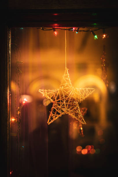 Christmas Star, Christmas Lights in a shop window. Krakow. Poland.