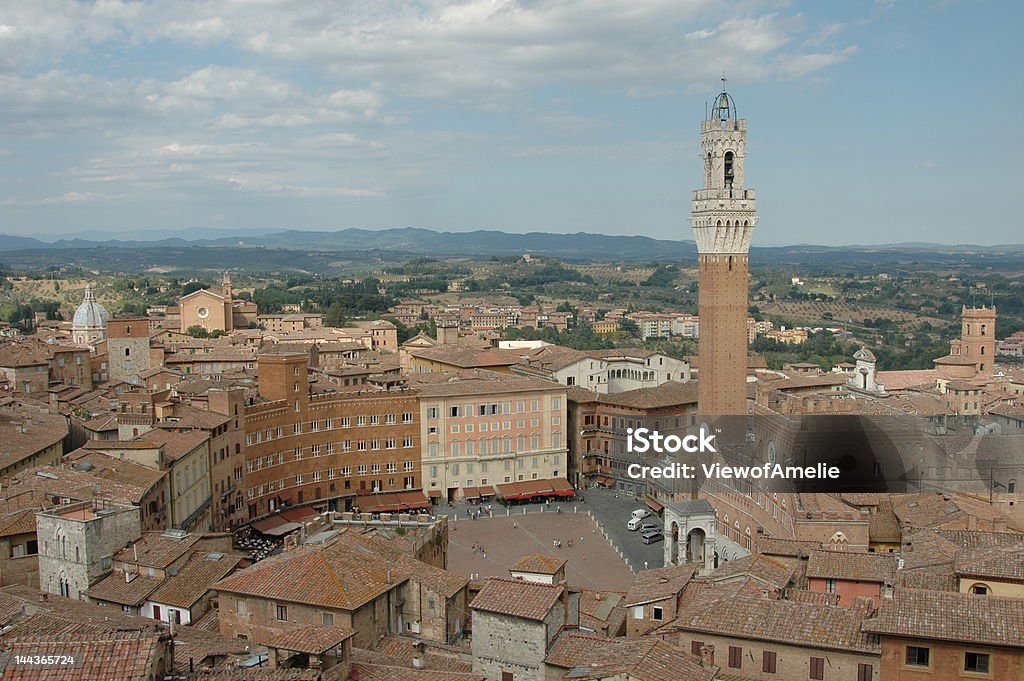 Tuscan beauty View over Siena's Piazza del Campo with its famous shell shape and the beautiful buildings that surround it Architecture Stock Photo