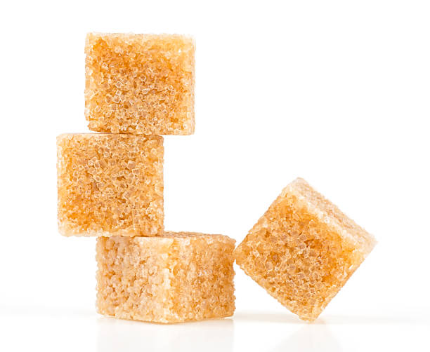 istock Brown cane sugar cubes isolated on a white background 1443658745