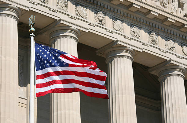 istock US flag waving in front of capitol building 144365925