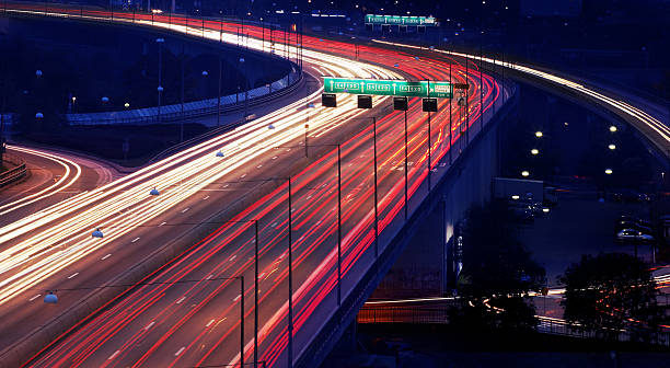 istock cars at night with motion blur 144365930