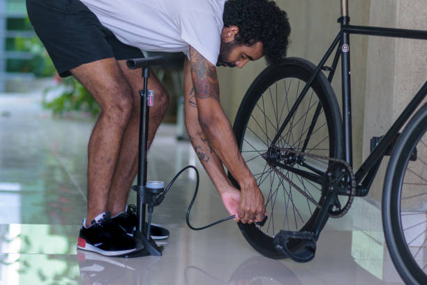 istock Young black man getting his fixed bike ready to ride 1443660465