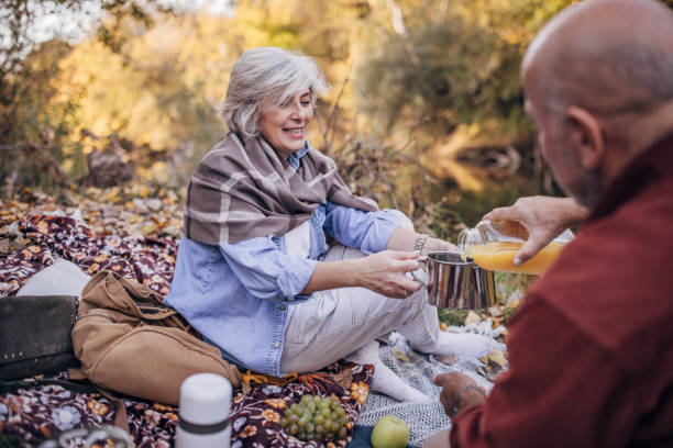 istock Mature couple relaxing by the river 1443662541