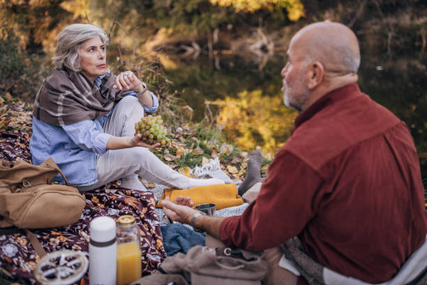 istock Mature couple relaxing by the river 1443662908