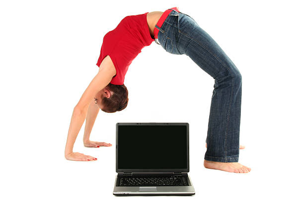 istock Woman doing yoga with laptop 144366397