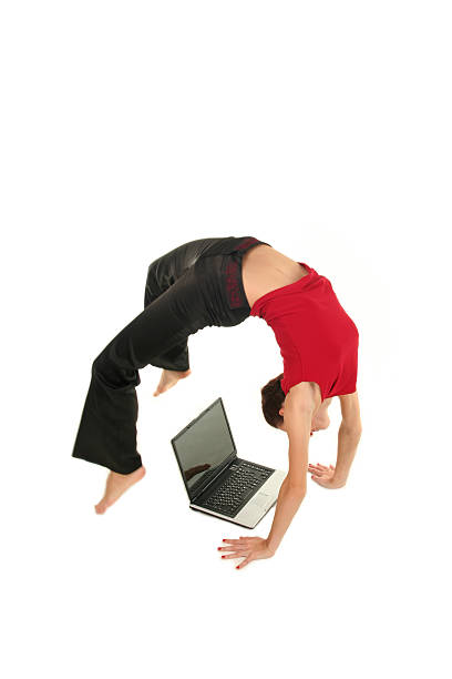 istock Woman doing yoga with laptop 144366494