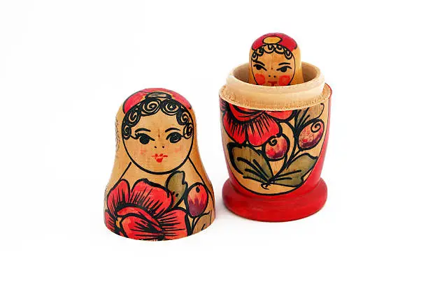 isolated curious handmade russian dolls babushka