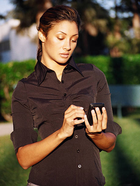 Woman Checking Messages stock photo