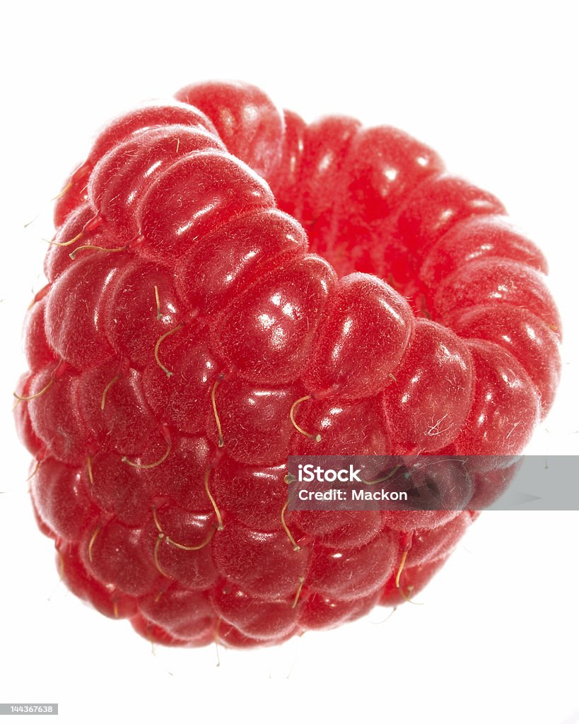 Close-up of a red and tasty raspberry raspberry. Isolated over white background Berry Fruit Stock Photo