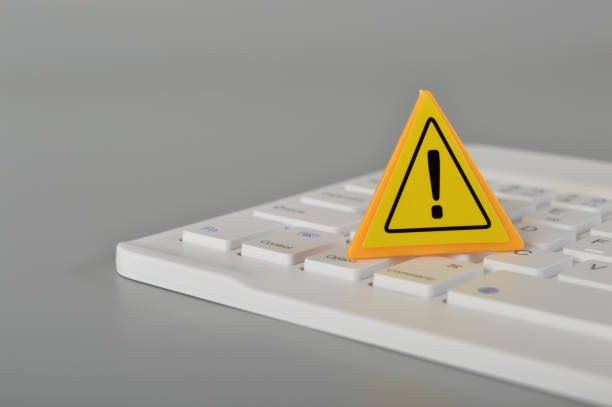 istock Laptop keyboard and warning sign. Data thief, internet fraud, cyber security concept. 1443677019